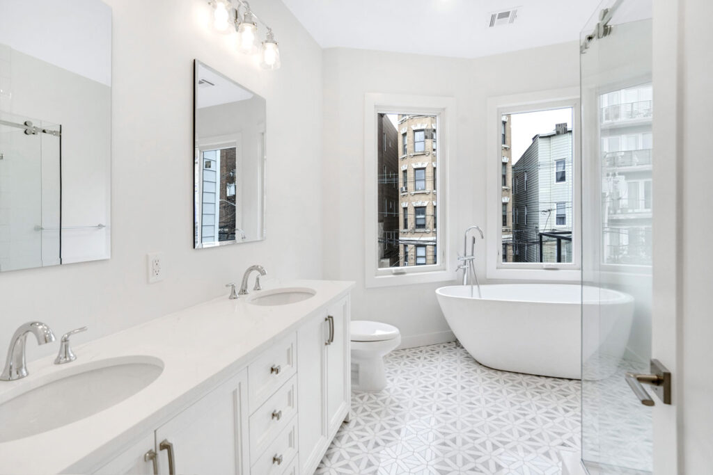 Jacuzzi bath remodel in a modern New Jersey home with clean white tiles and built-in spa tub