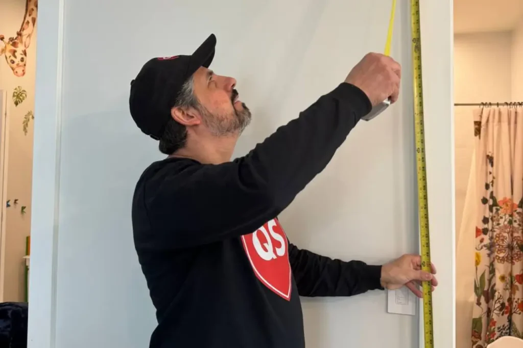 Professional handyman fixing a kitchen cabinet in North New Jersey