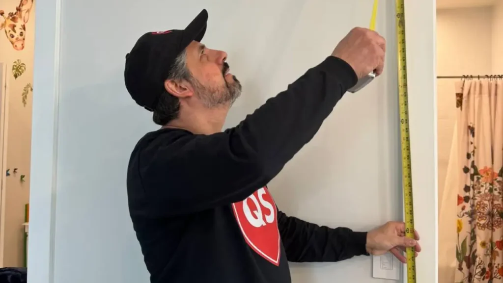 Professional handyman fixing a kitchen cabinet in North New Jersey