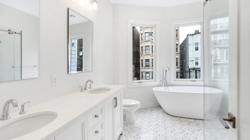 Jacuzzi bath remodel in a modern New Jersey home with clean white tiles and built-in spa tub
