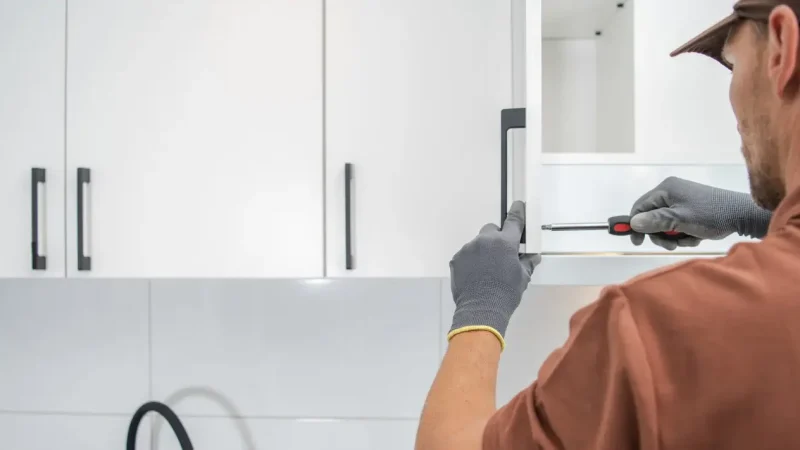 handyman working kitchen cabinet in hoboken| Quick Sidekick | handyman services in Hoboken NJ